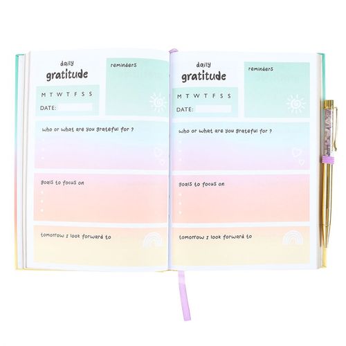 Interior of CU29 Living gratitude journal showing lined pages and daily prompts for reflection and gratitude