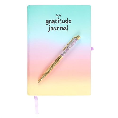 CU29 Living amethyst crystal pen resting beside pastel gratitude journal – promotes clarity and spiritual focus.